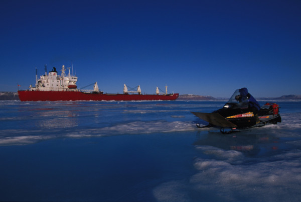 An Inuit man watches an icebreaker, Nunavut, Canada. © Paul Nicklen/National Geographic Stock / WWF-Canada